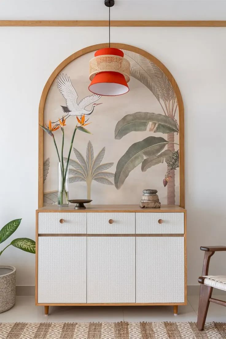 Arched niche with sideboard, pendant light and botanical mural