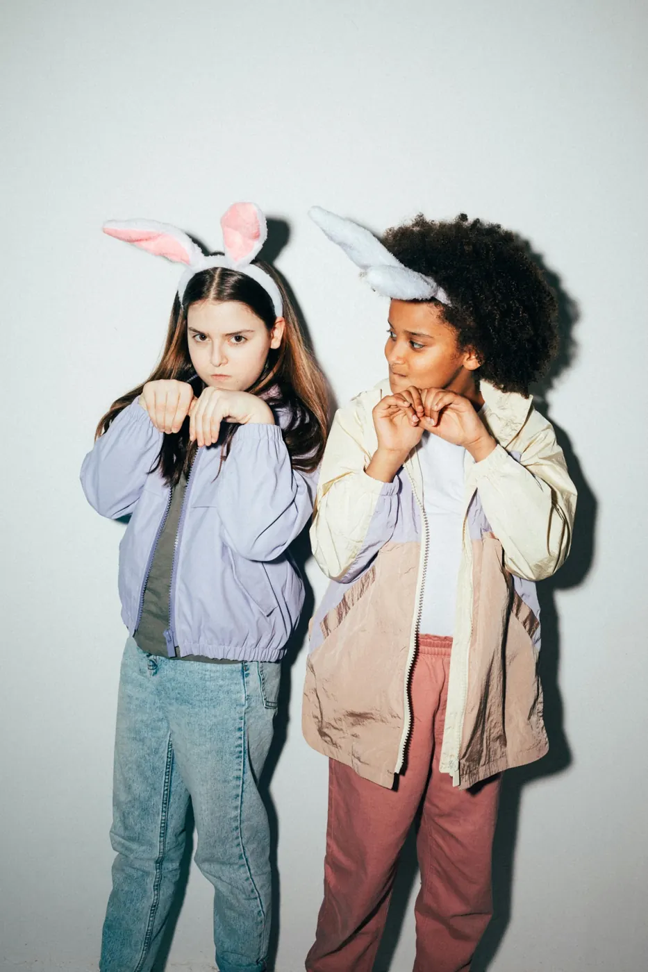 Two children in layered casual outfits